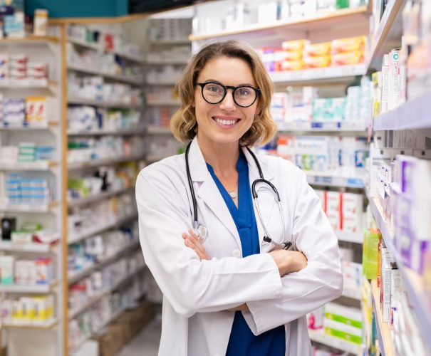 Happy smiling pharmacist in drugstore